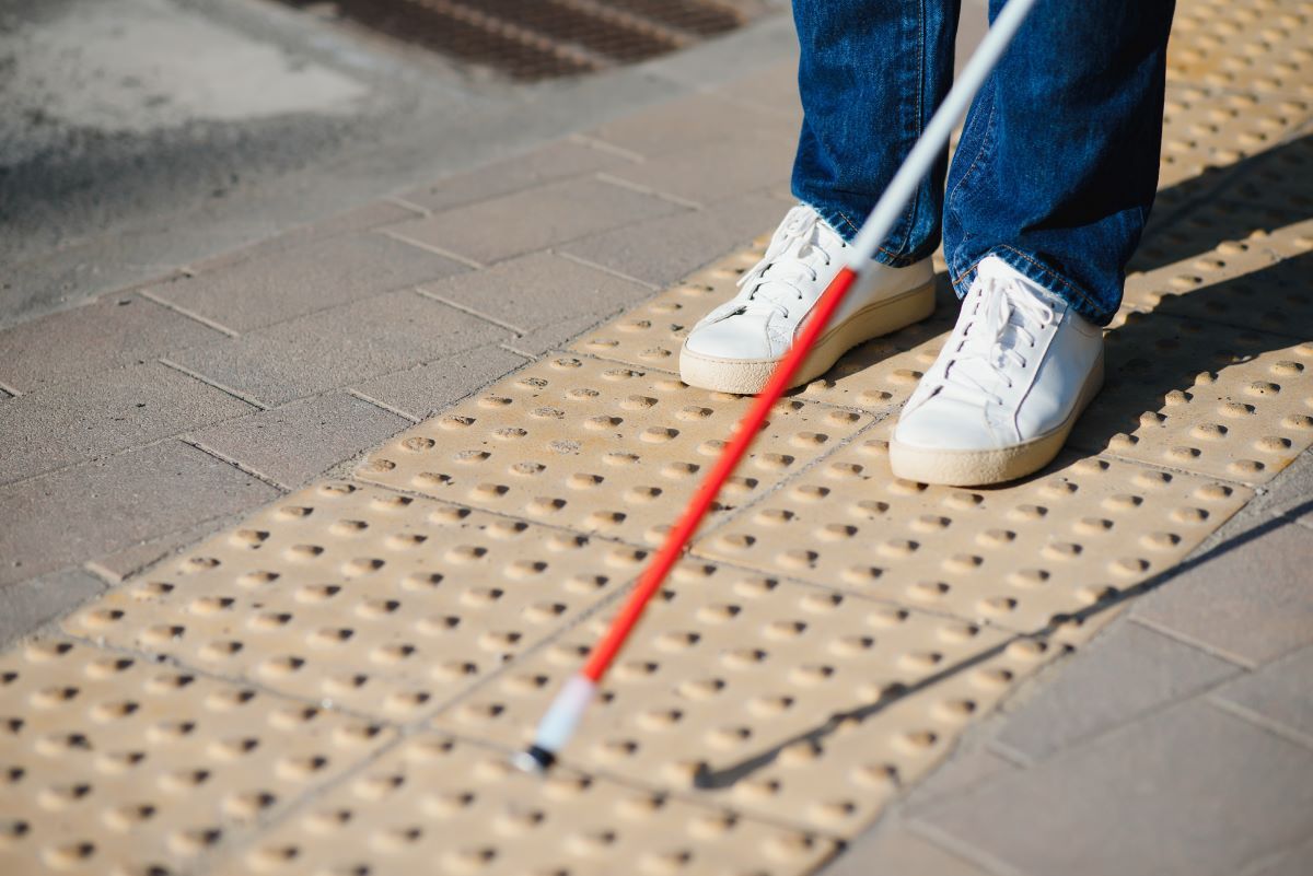 close-up-of-a-blind-man-standing-with-white-stick-2023-12-05-02-57-33-utc (1)