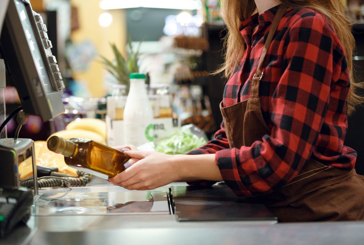 cashier-lady-on-workspace-in-supermarket-shop-2023-11-27-05-23-32-utc