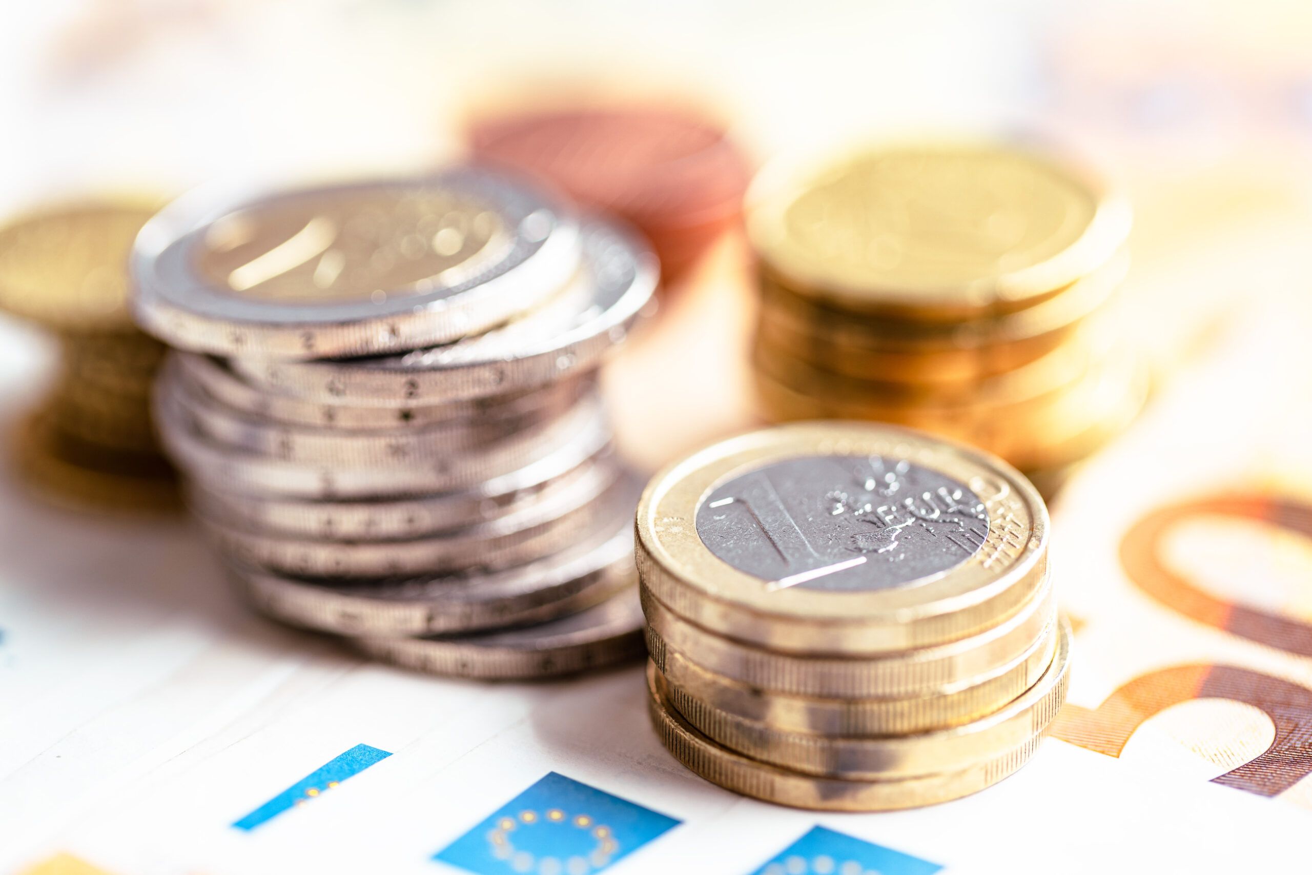 Euro coins on euro banknotes